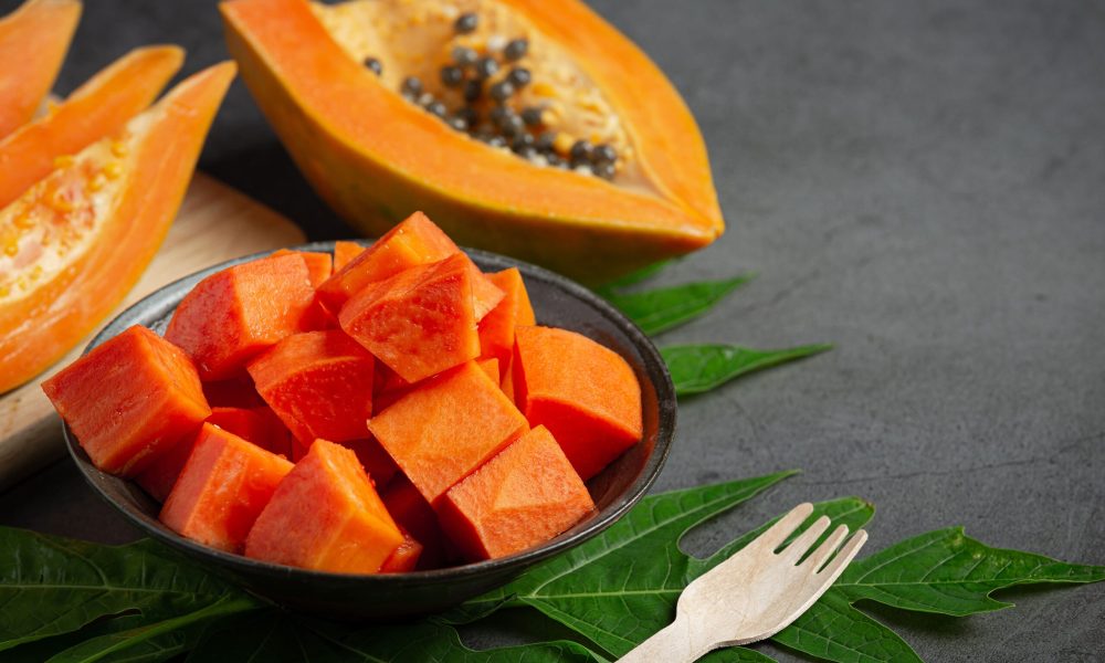 fresh-papaya-cut-into-pieces-put-black-plate